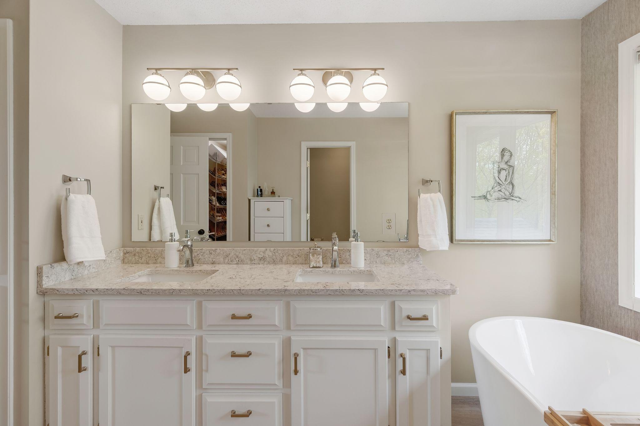 Dual sinks and built-in linen closet