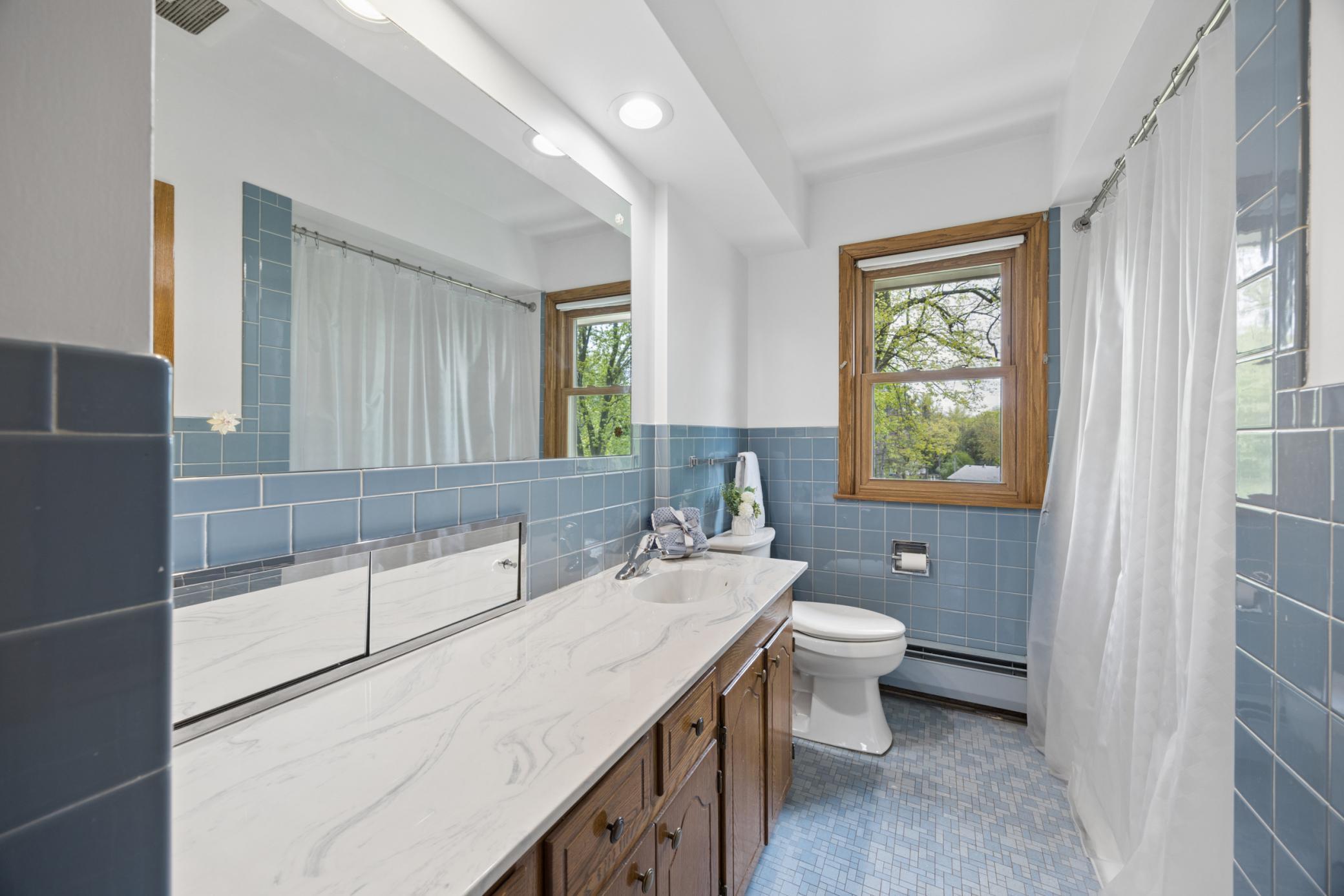 Full main level bath includes an oversized vanity.