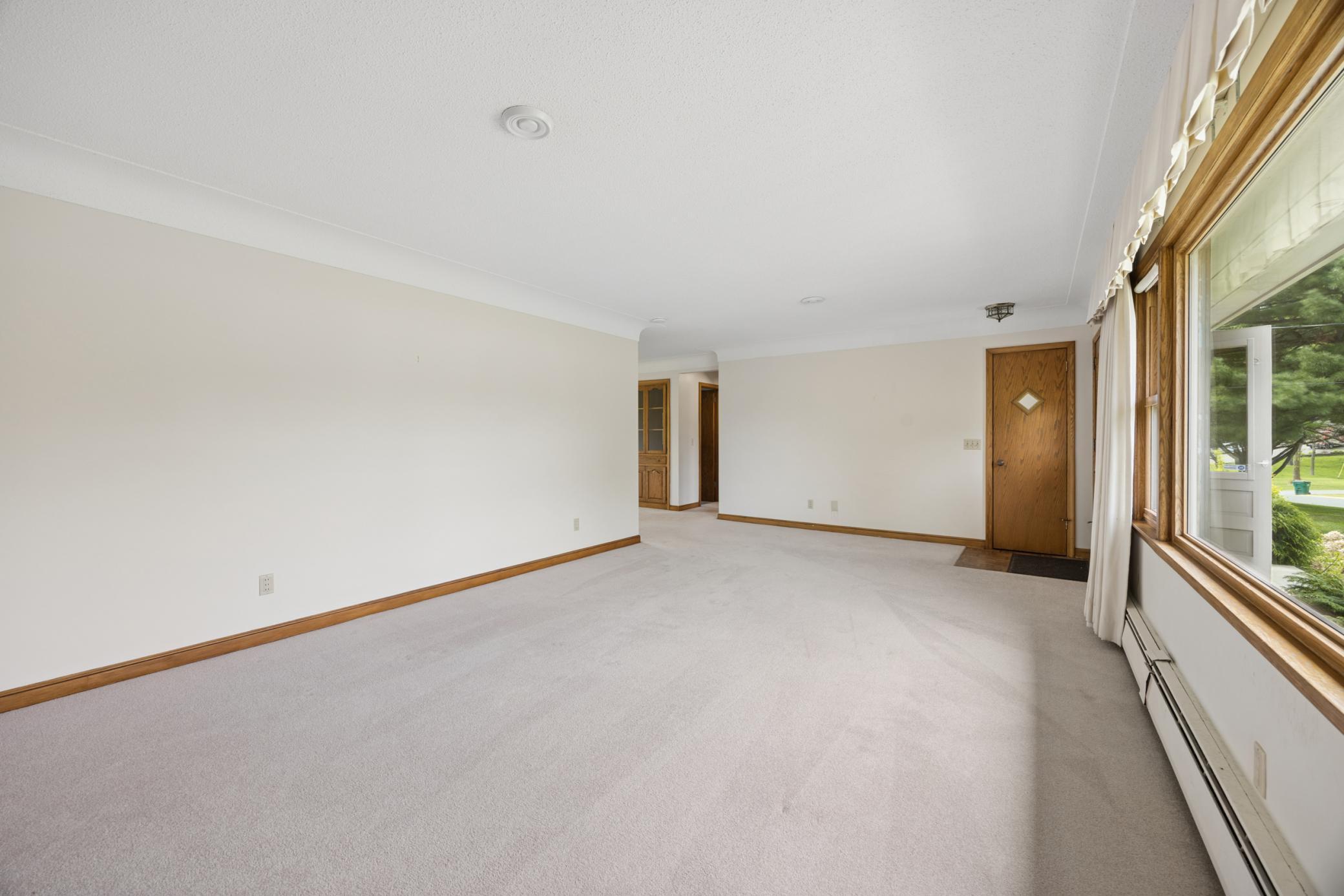 The living room has plenty of room for large furniture.