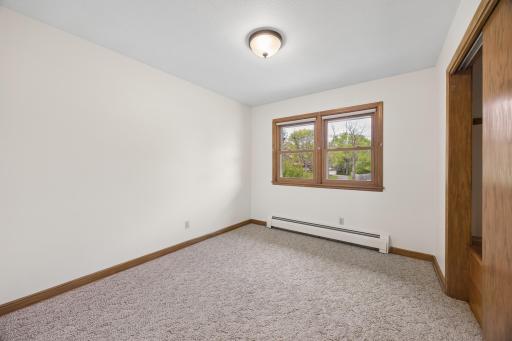 3rd bedroom overlooks the front yard and has a large closet with built-in storage.