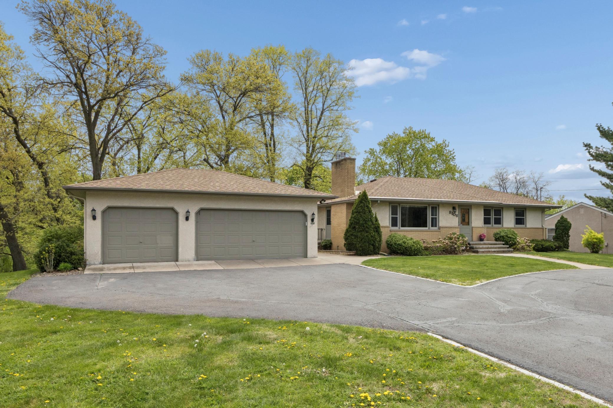 Oversized triple garage has plenty of room for cars, boats and more