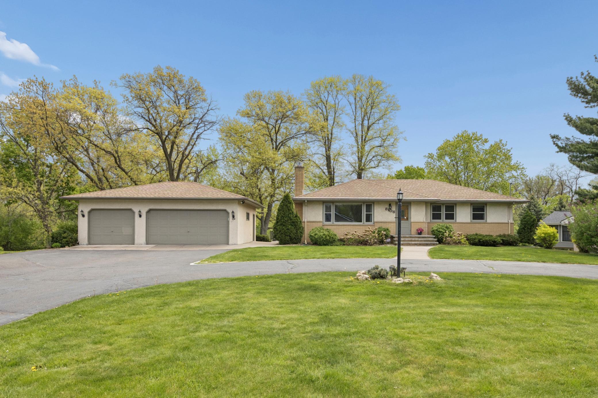 A rare 3-car garage offers exceptional storage and functionality, with ample additional space for guest parking.