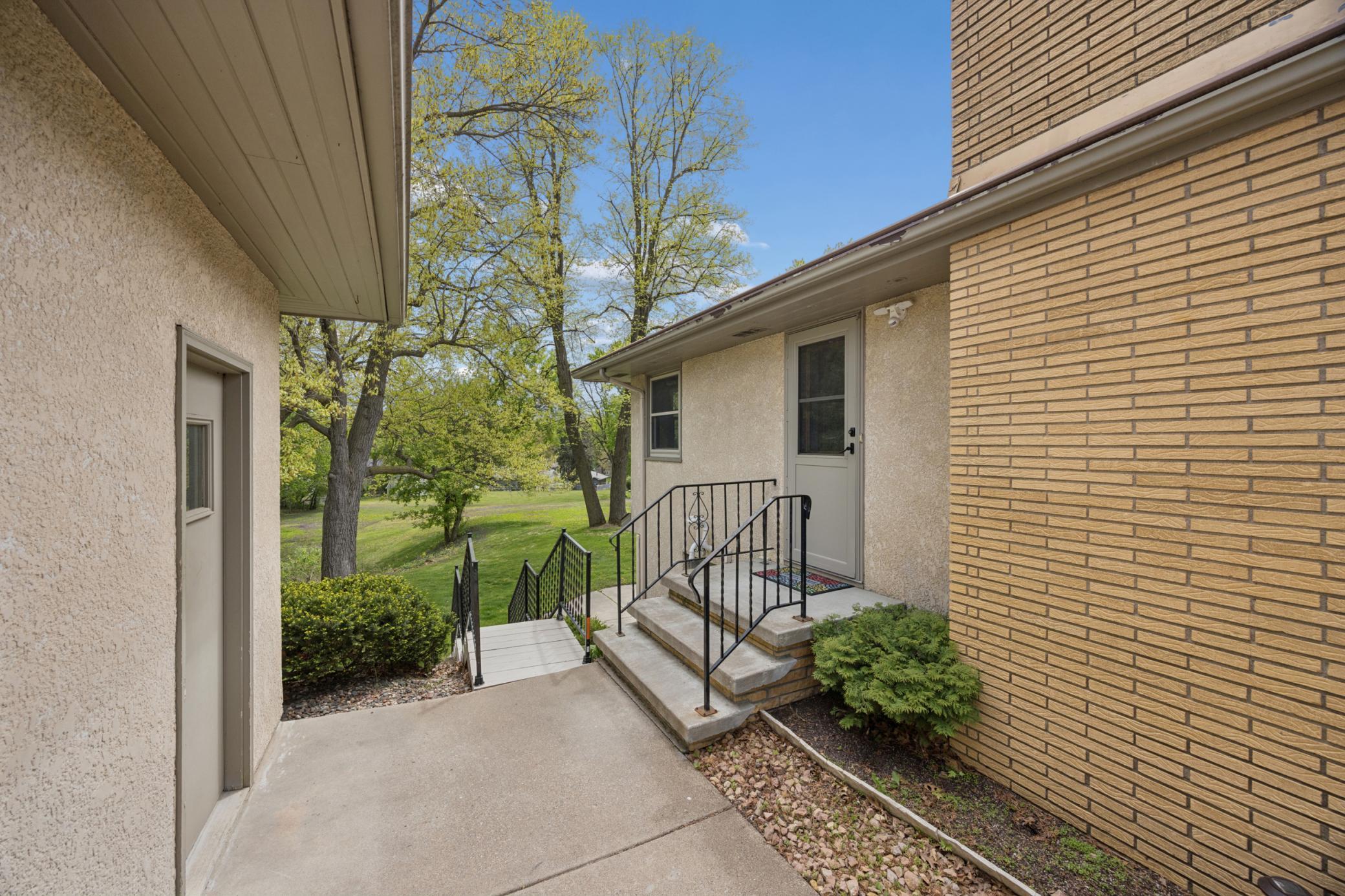 Just a few short steps to the detached garage and stairs to the backyard.