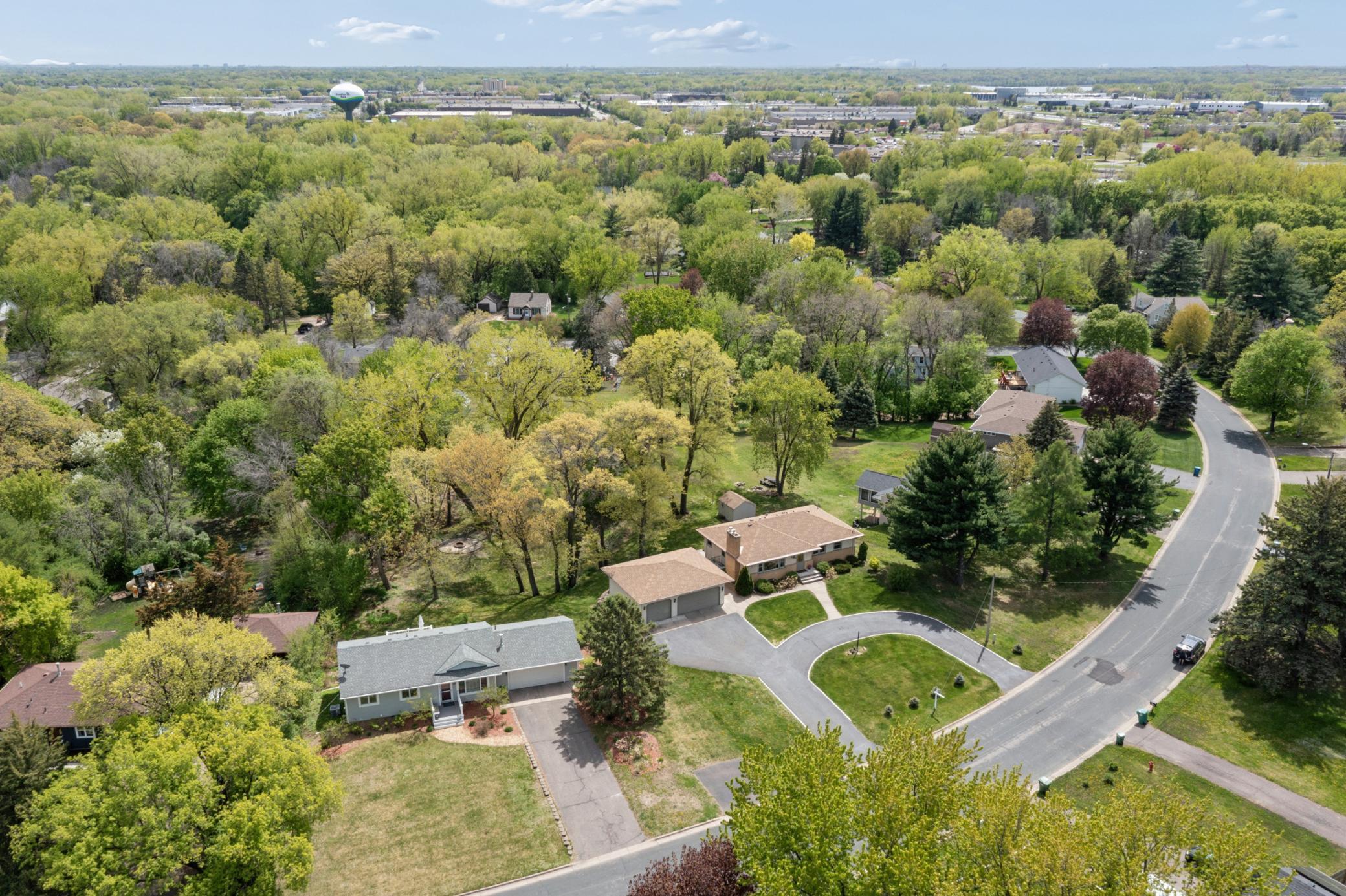 • Stunning aerial views showcase the expansive yard, mature trees, and beautiful natural surroundings