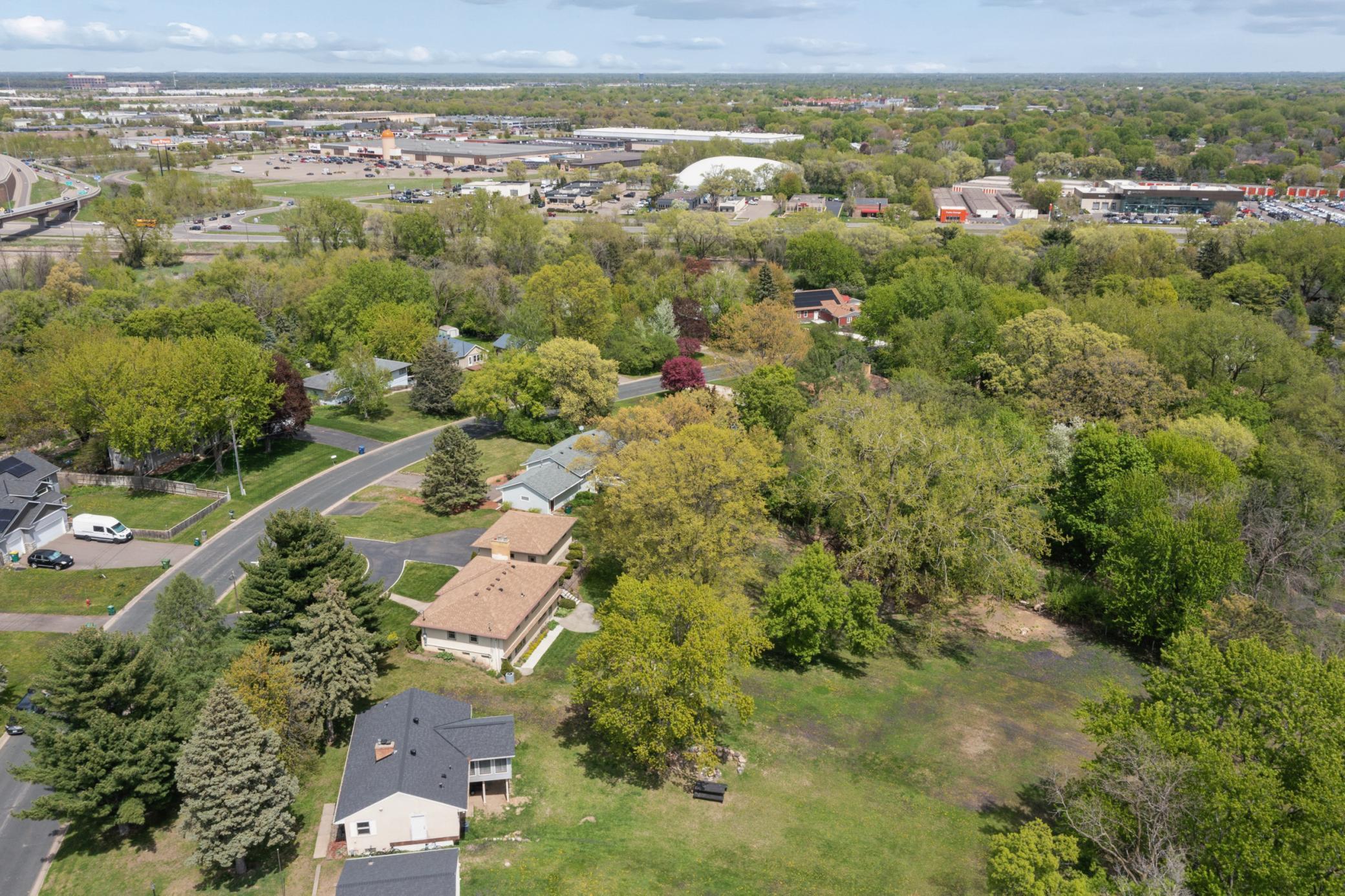 Enjoy nature views in every direction from this serene, wooded setting