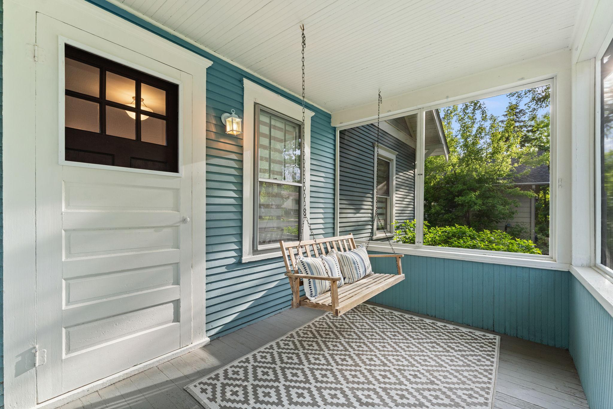 Enjoy this welcoming screened in front porch.