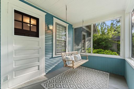 Enjoy this welcoming screened in front porch.