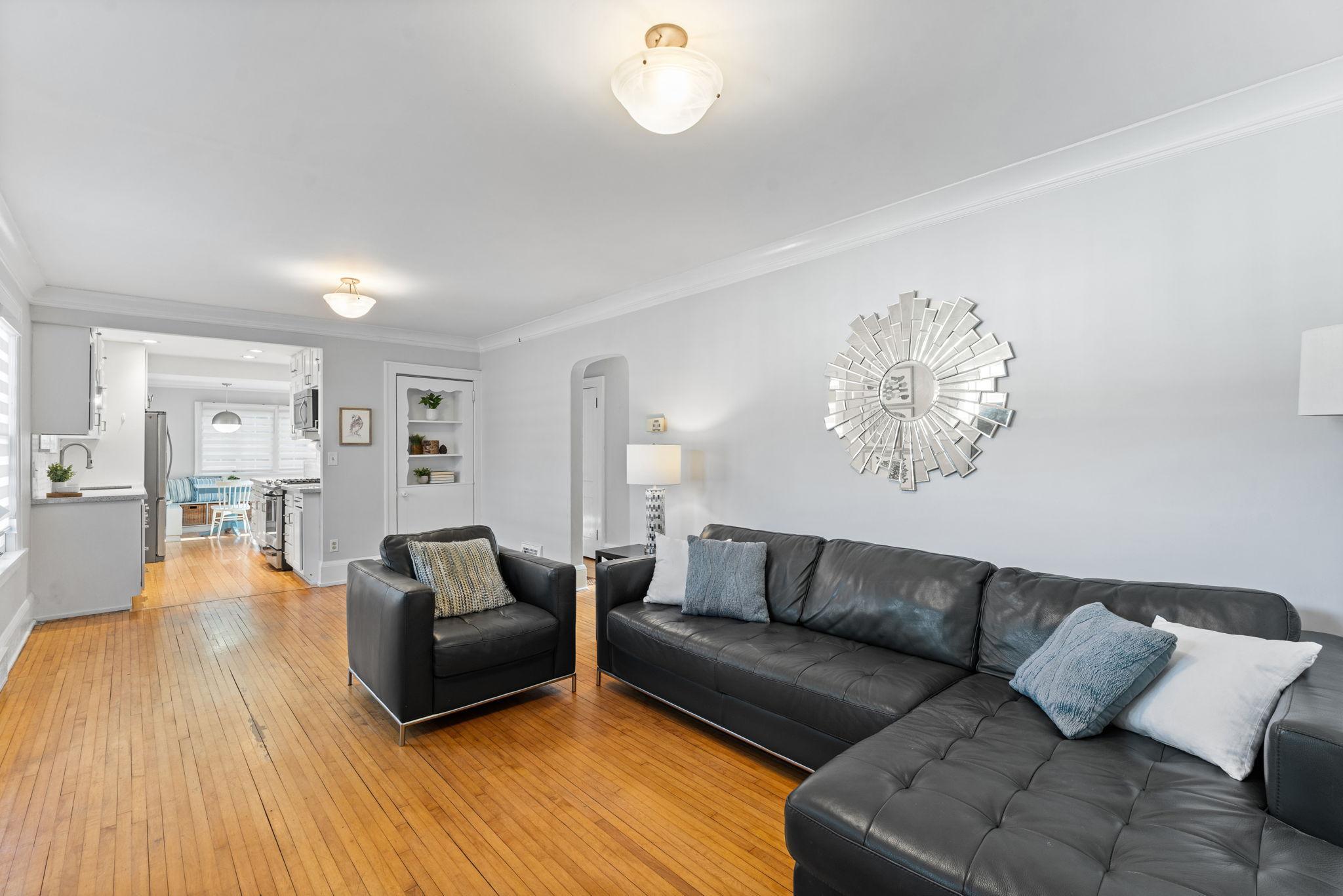 Original hardwood floors, generous light filled spaces and an open floorplan greet you.