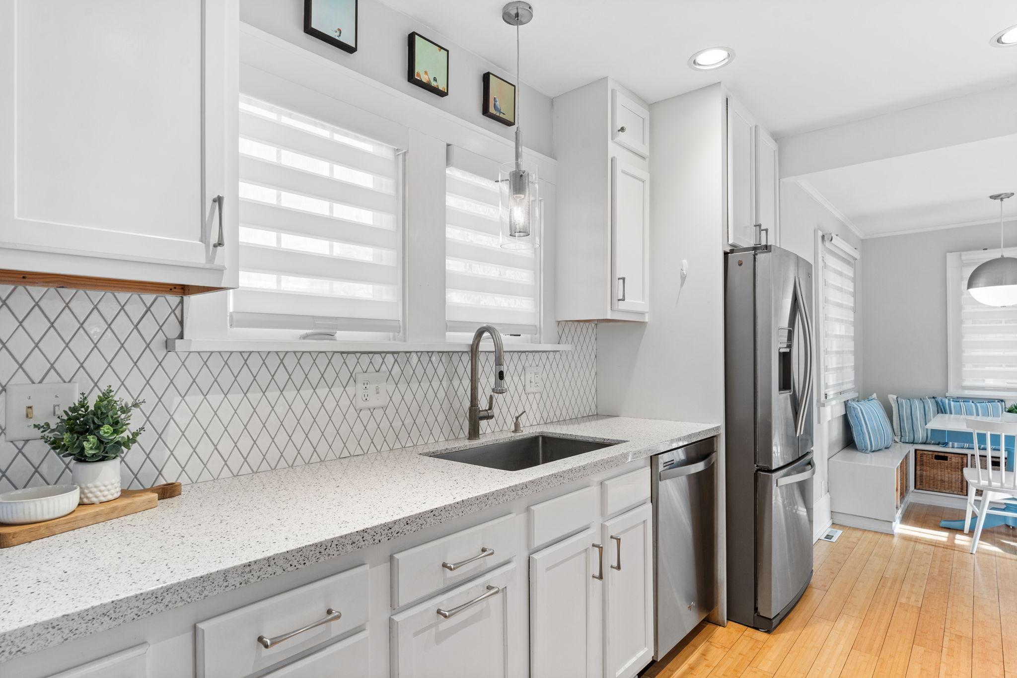 Featuring an updated kitchen with ample cabinetry and counterspace!