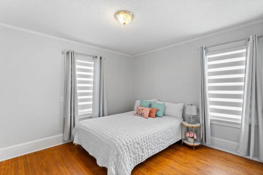 First of the two of the spacious main level bedrooms with hardwood floors and new room darkening shades.