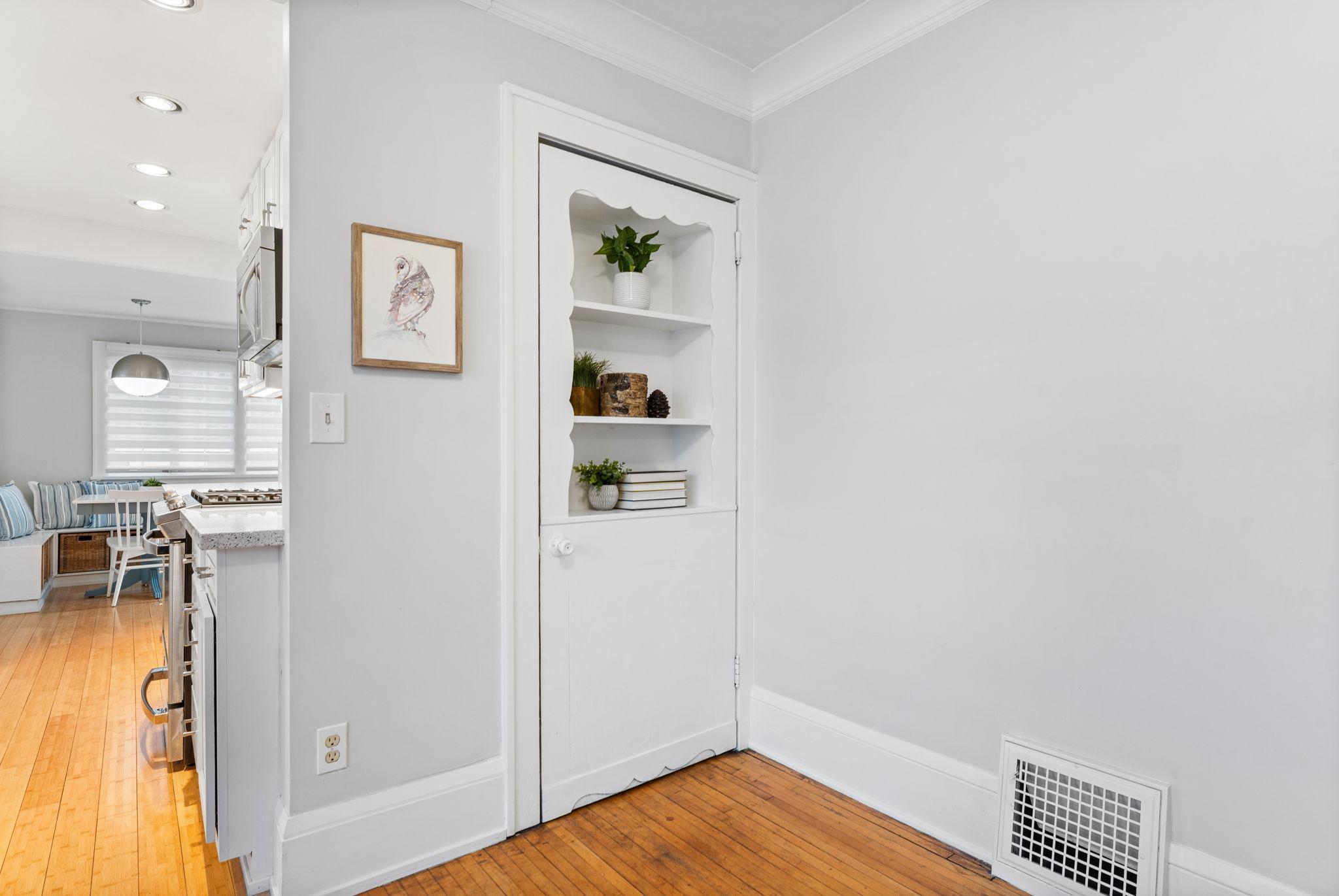 Decorative niche built into the door adds to the charm.