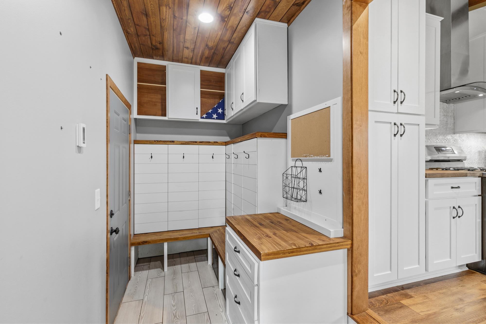 You'll love this mudroom with the storage cubbies and coat hooks!