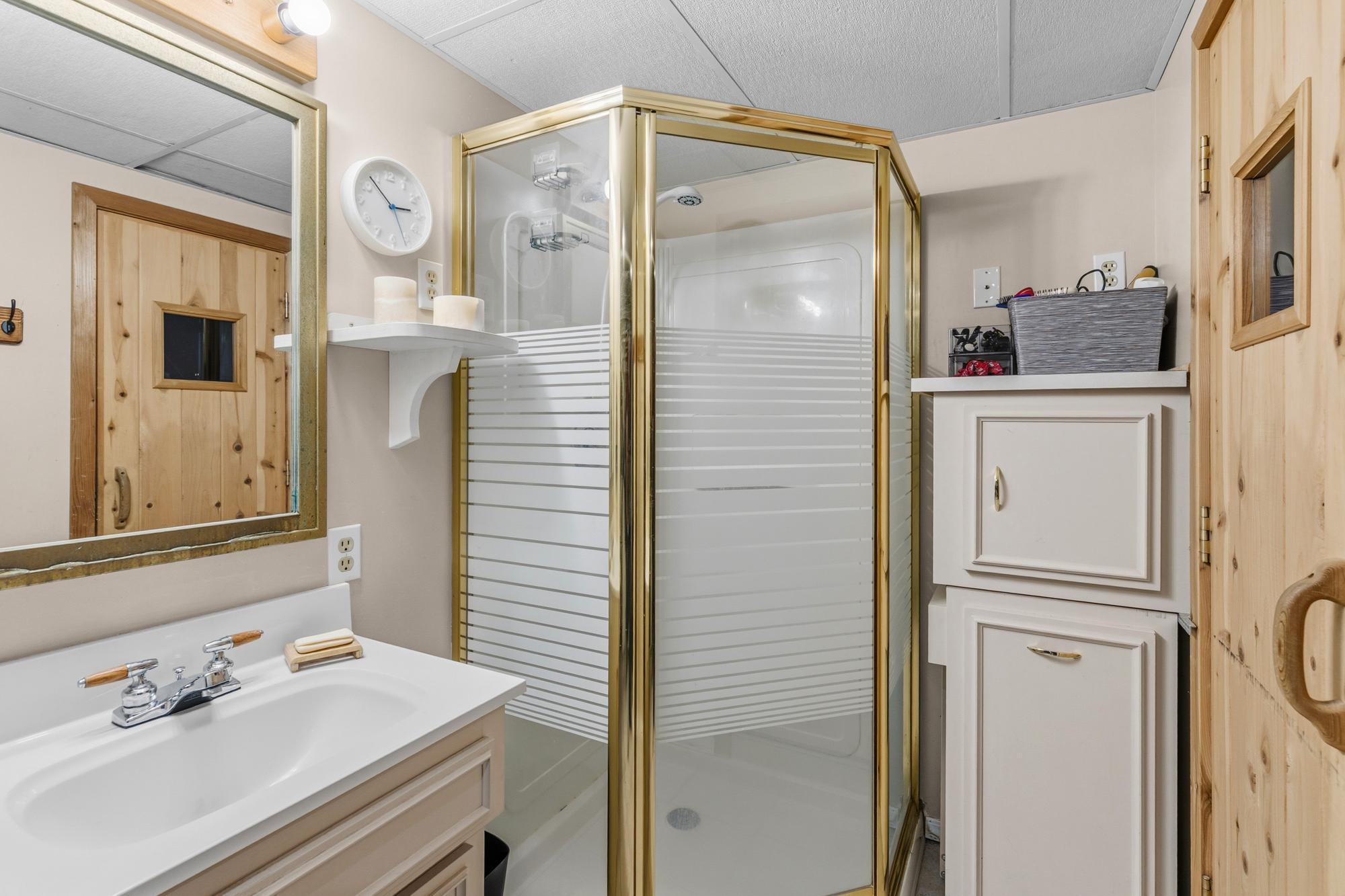 1/2 bathroom in the basement (sink and shower - no toilet). It also leads to the sauna!