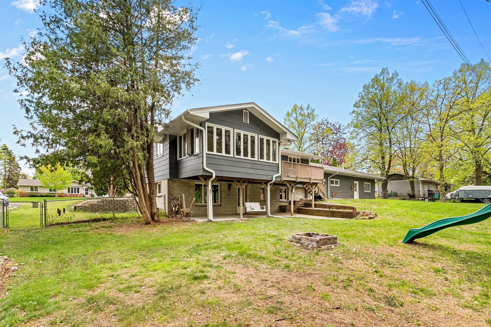 This is a 1/2 acre lot with woods and a full chain link fence.