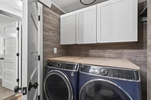 Laundry room space, shared with full bath, crafty storage space!