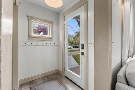 A welcoming entry with hooks and a closet provides practical everyday organization and sets a warm tone from the start.