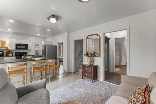 The main level also includes a finished laundry room complete with Kenmore washer and dryer, closet storage, and built-in shelving for added convenience.