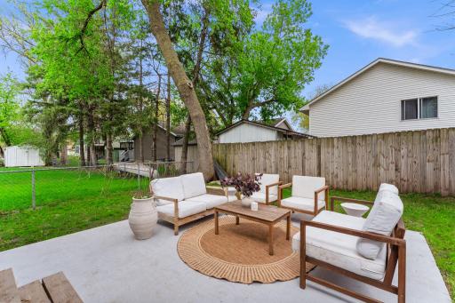 Fully fenced yard provides both functionality and peace of mind.