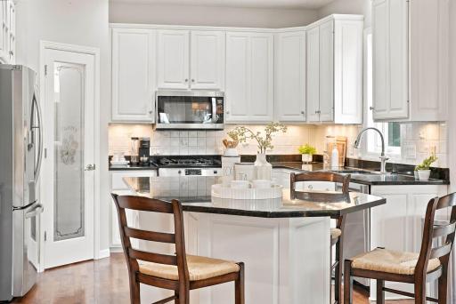 Enjoy breakfast bar seating and a walk-in pantry.