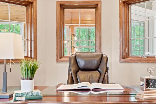 Surrounded by natural light, this home office is a showstopper.