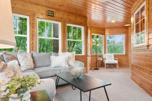 Step into the sun drenched porch right off the office.