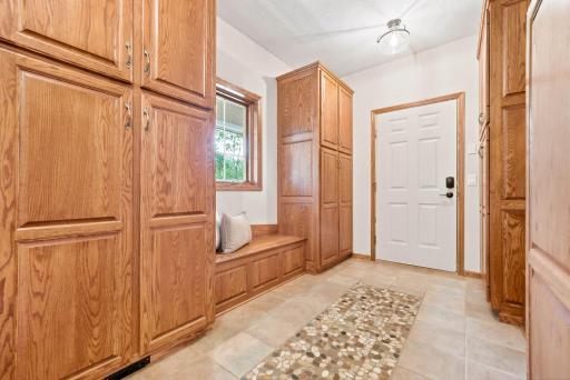 This mudroom offers ample storage for shoes, jackets, and so much more.