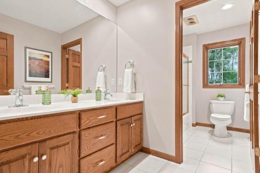 Upper level bathroom features dual sinks.