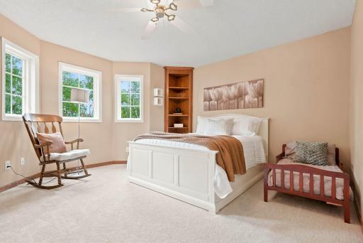 Upper level bedroom is spacious and bright.