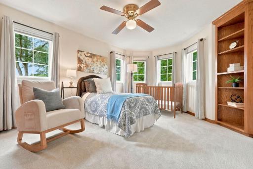 Upper level bedroom features built-in storage and panoramic views.