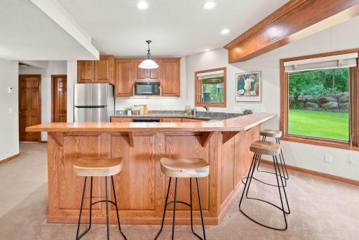 Bar seating makes this space the perfect hangout for movies or game night.