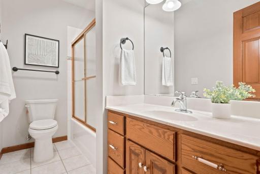Full bathroom in the lower level is convenient and serves two bedrooms.