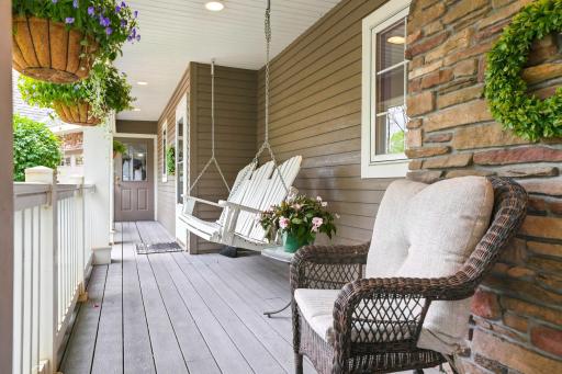 The front porch and swing is right out of a storybook.