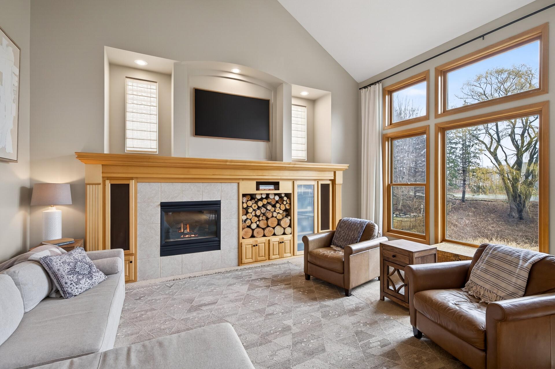 Oversized picture windows flood the room with natural light