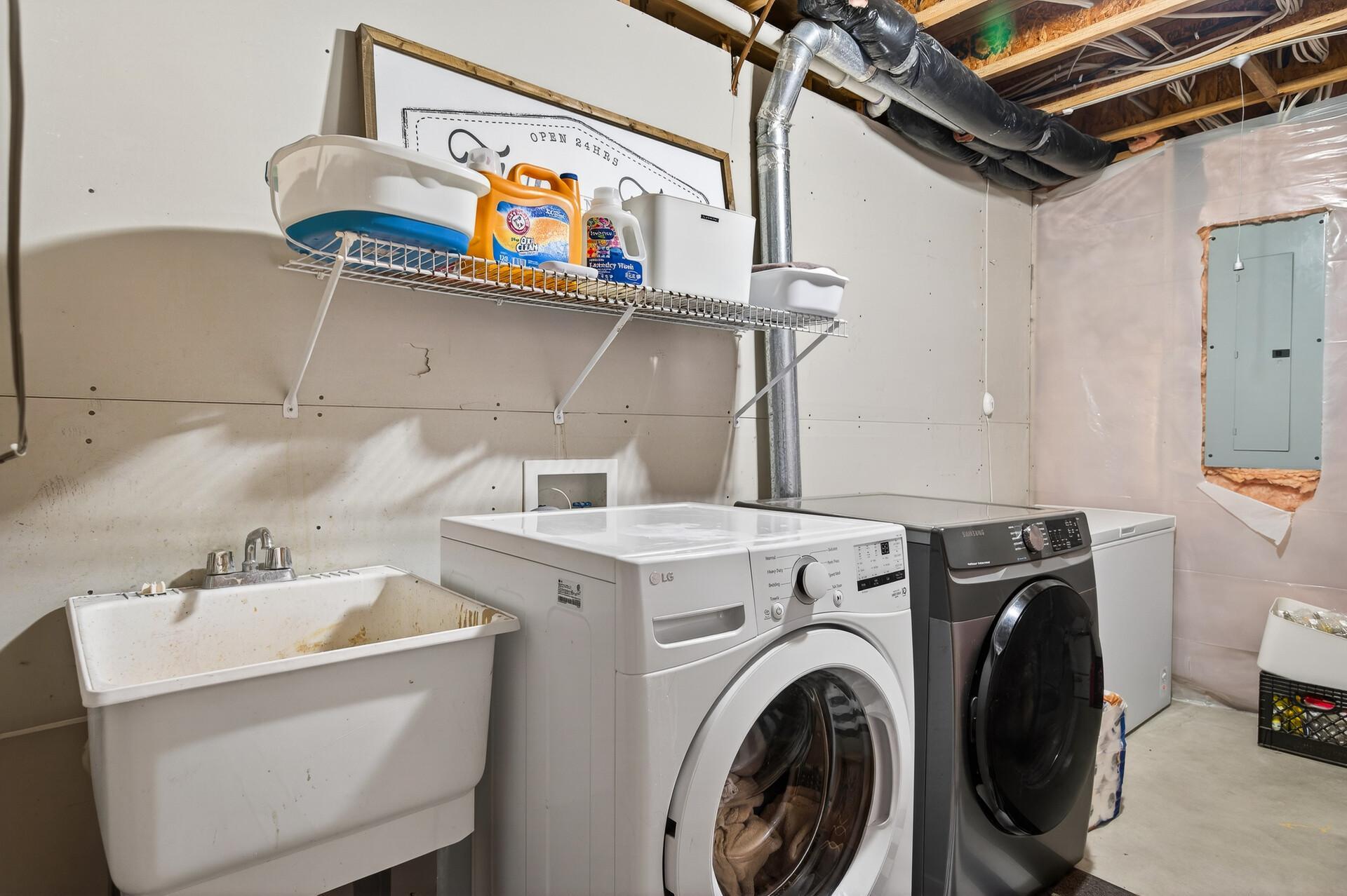 Large laundry room with utility sink