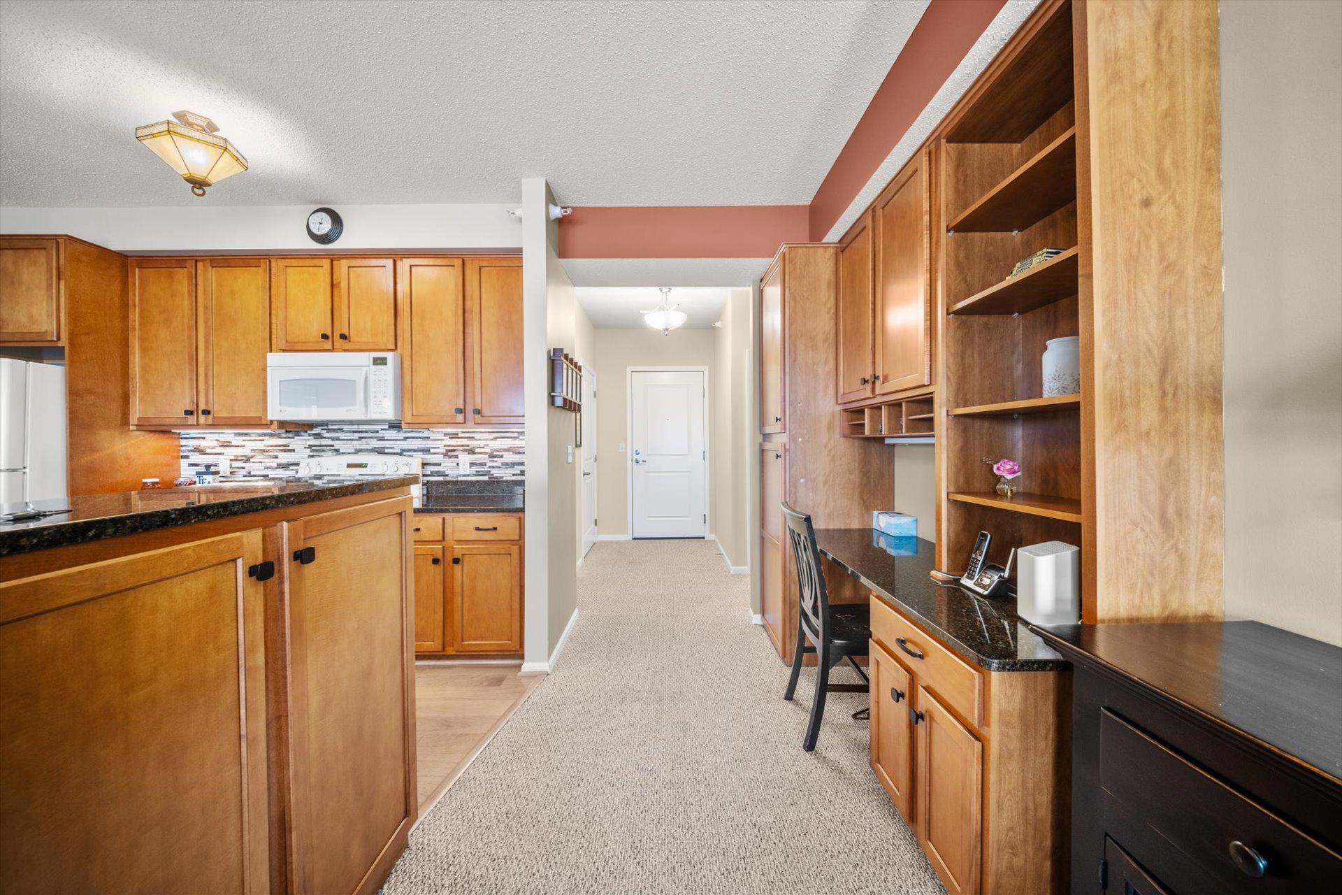 Spacious hallway with beautiful built-in cabinets.