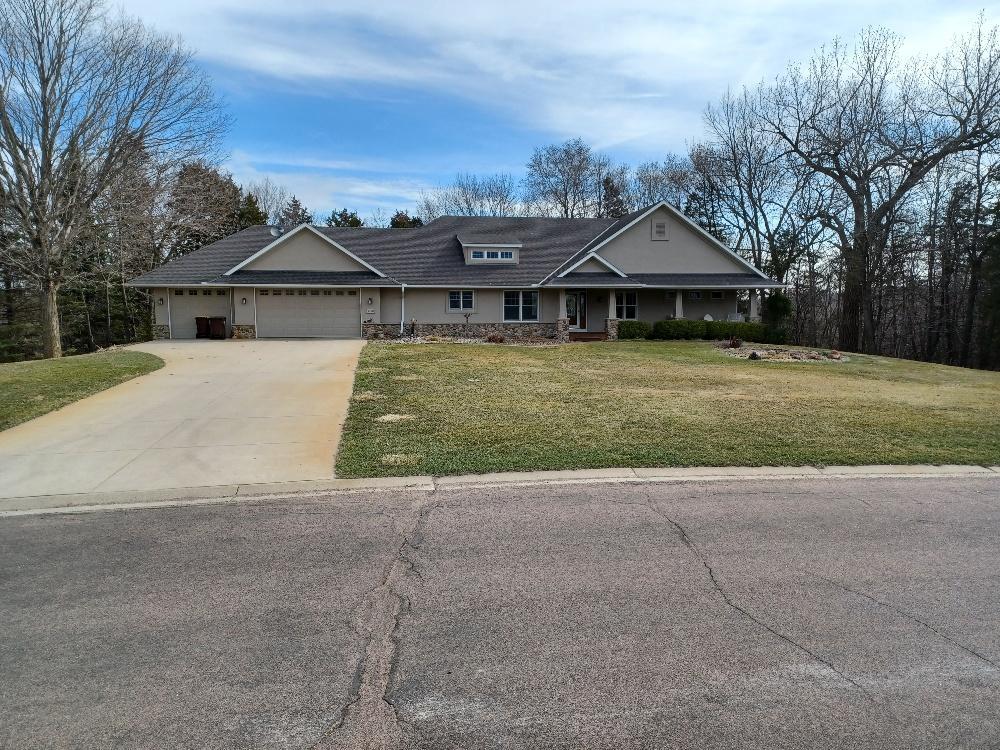 Front of home faces west and overlooks Hole #2 on Ridges at Sand Creek.