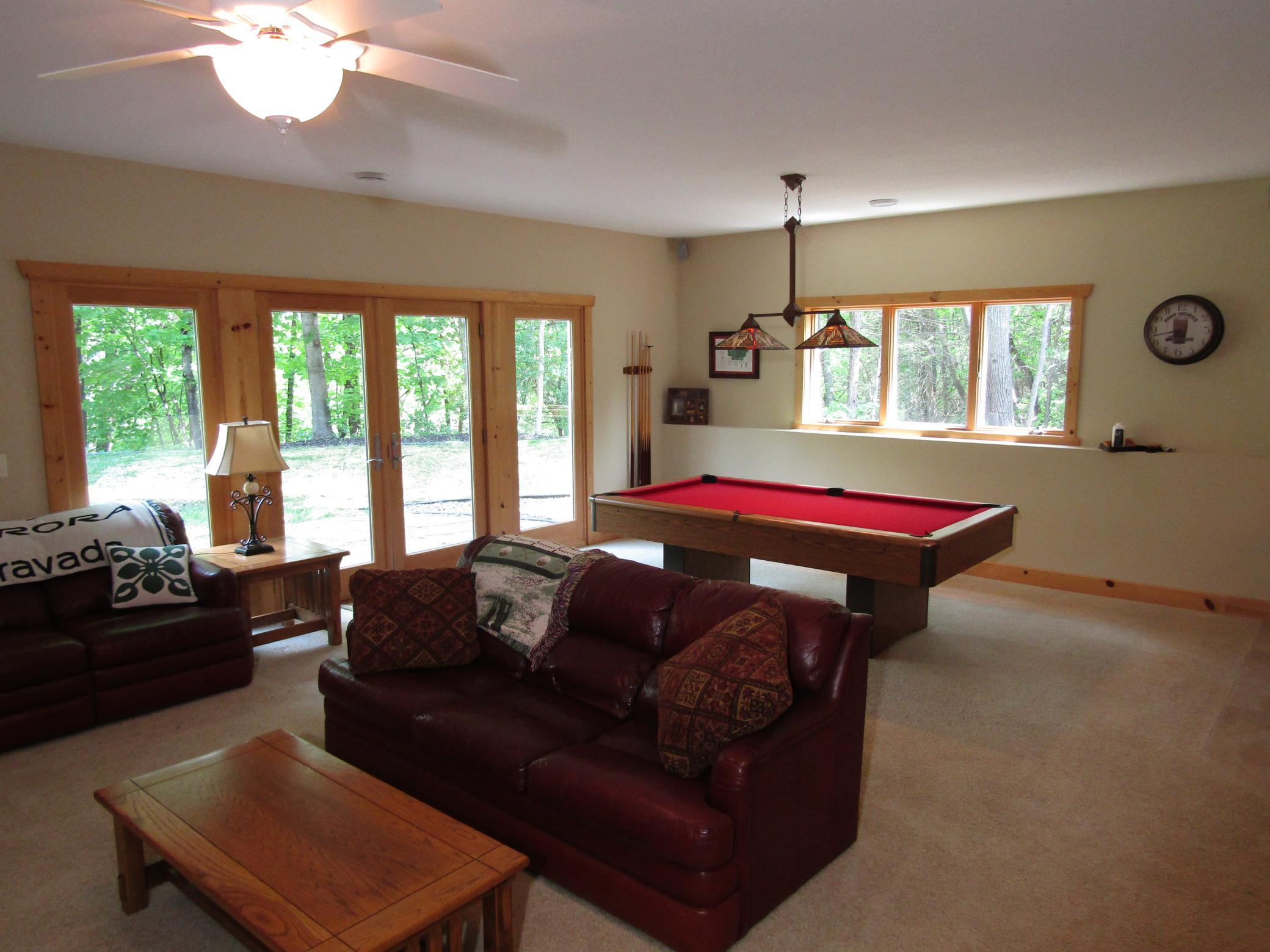 Walkout lower- level family room with gas fireplace.