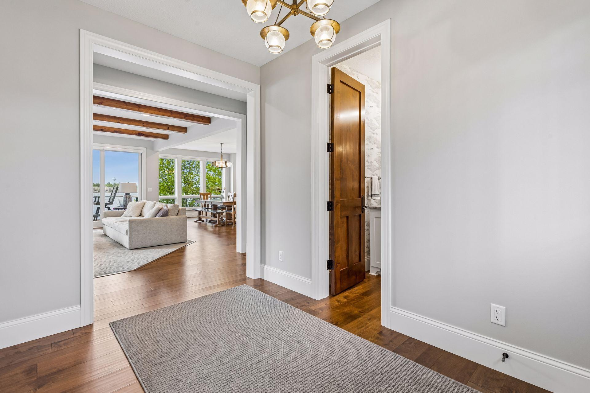 Spacious foyer offering immediate lake views upon entry.