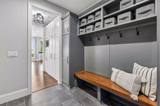 Functional mudroom with custom built-ins and closet.