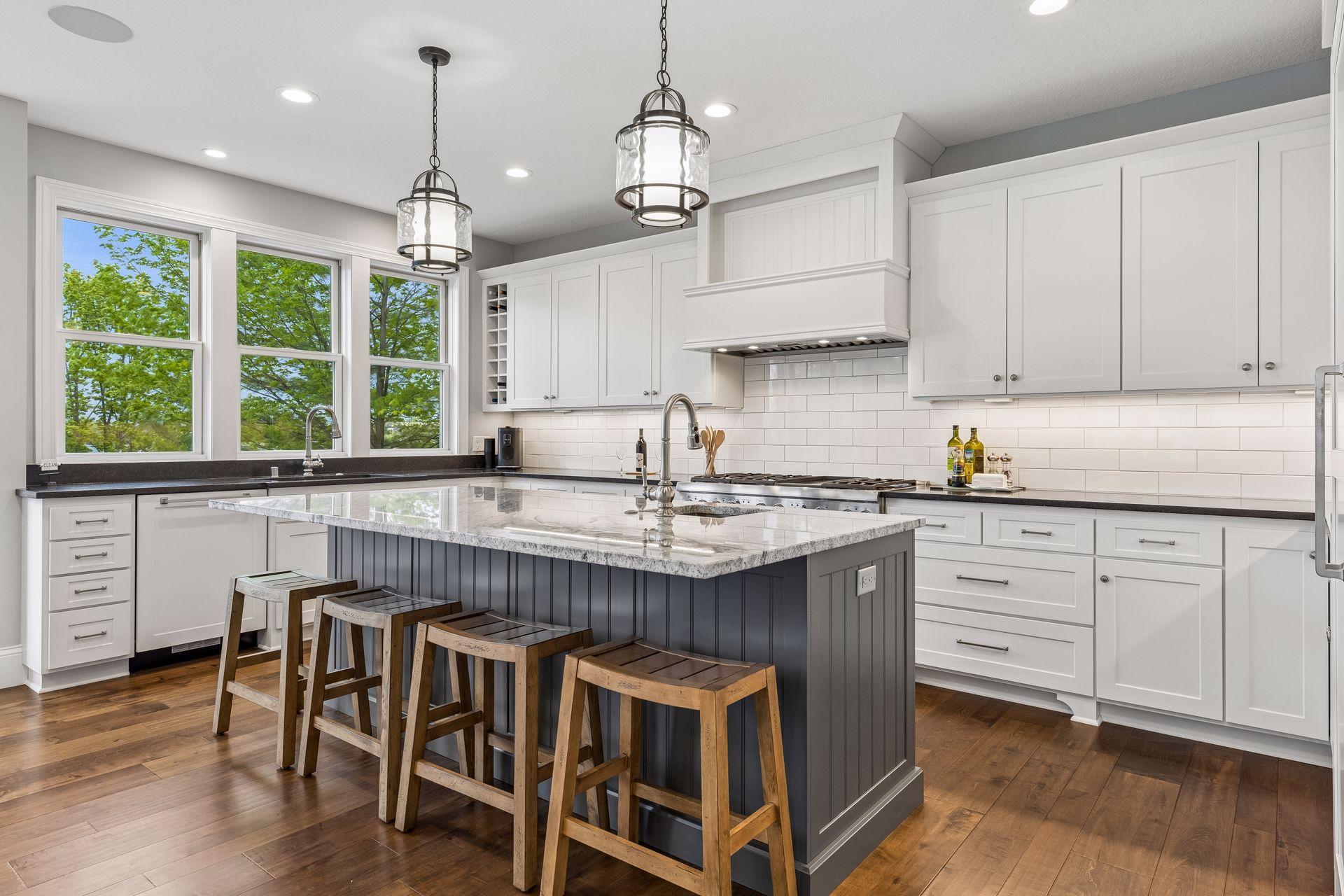 Large center island with prep sink and seating.