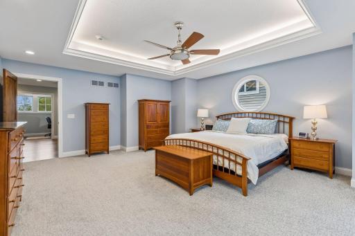 Primary suite is the perfect retreat with tray ceilings.