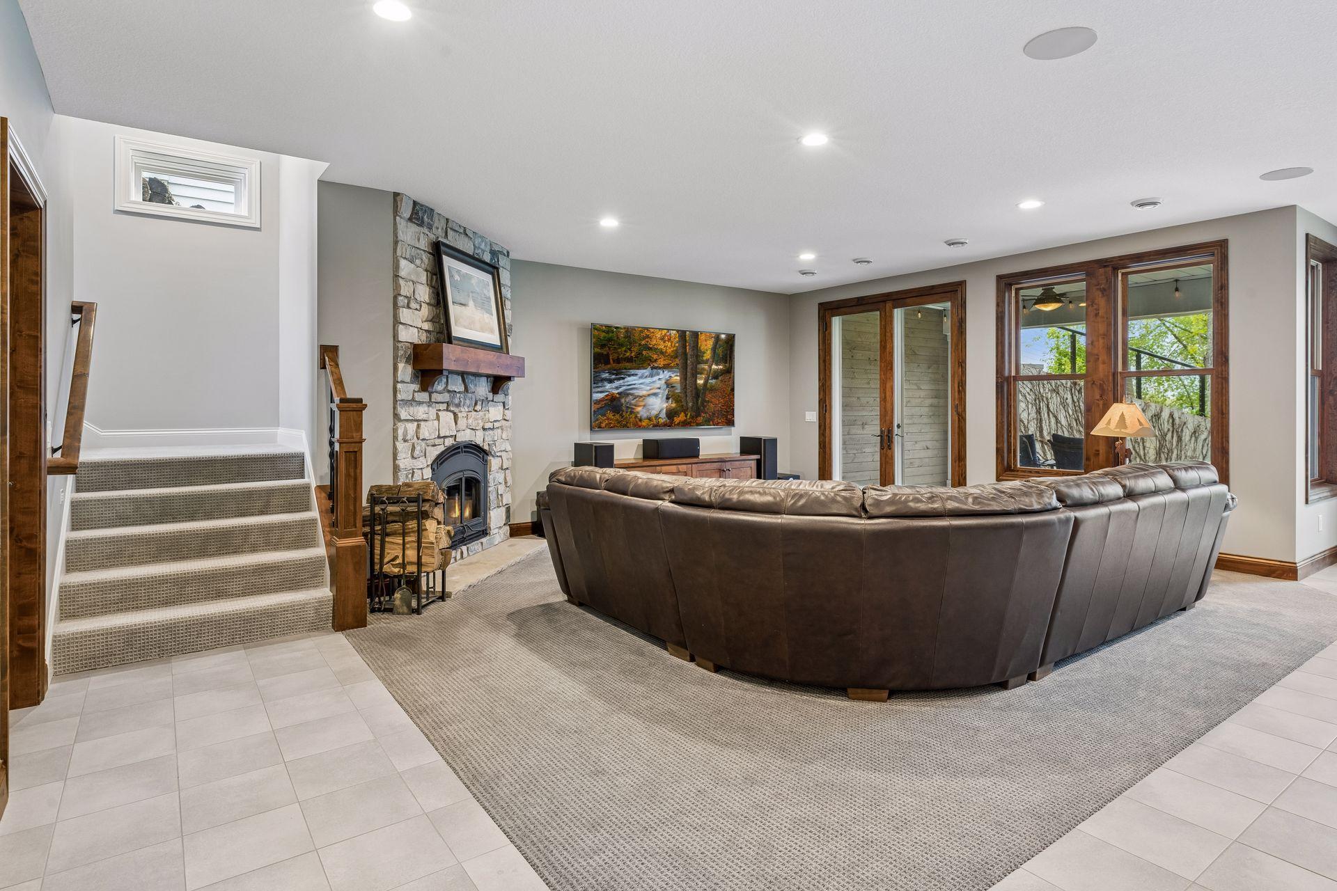 Walk-out lower level is highlighted by a spacious family room with wood-burning, stone fireplace.