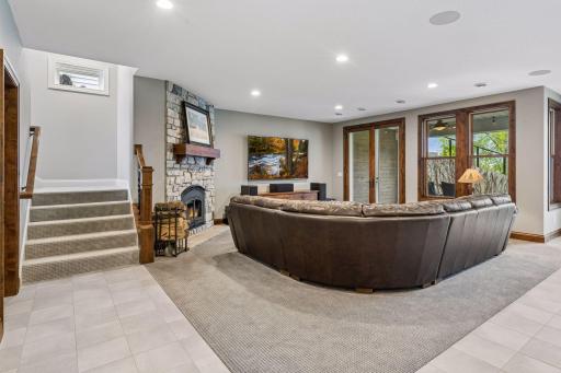 Walk-out lower level is highlighted by a spacious family room with wood-burning, stone fireplace.