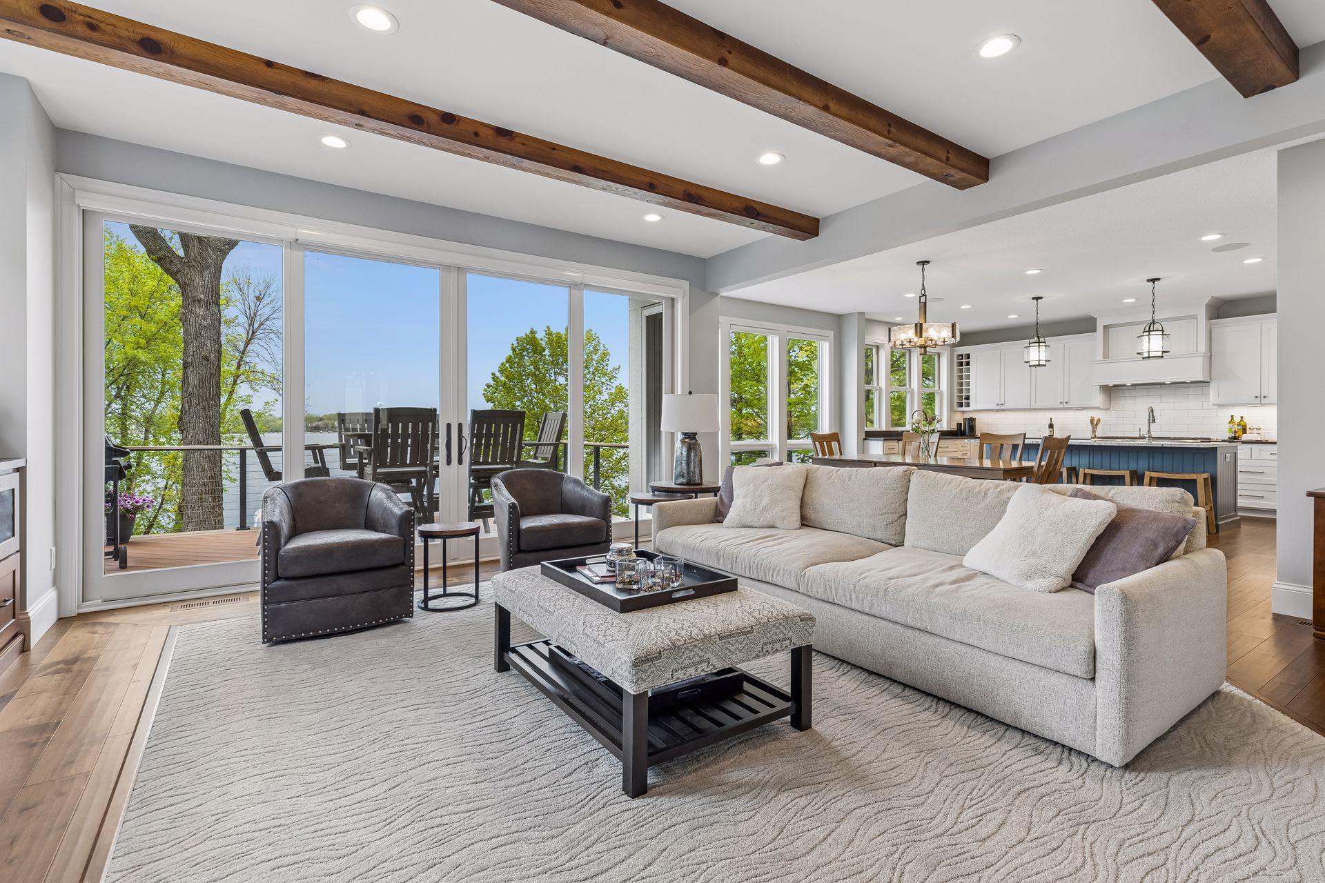 Walls of windows and direct deck access maximize the stunning lake setting.