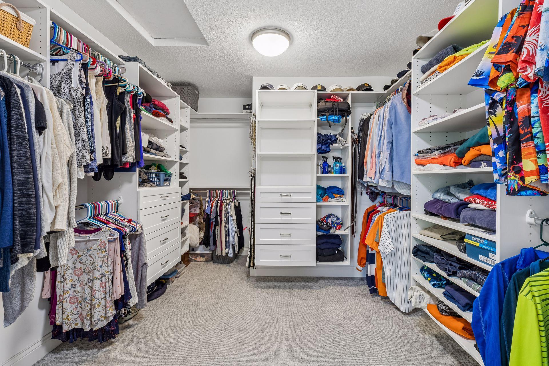 Large primary bedroom closet with easy access from the bathroom.