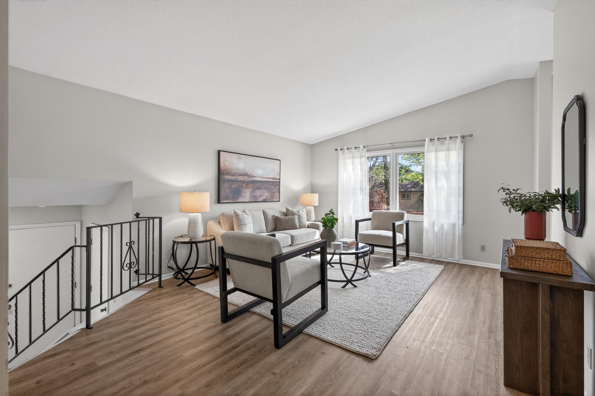 Vaulted ceilings throughout main level space creates an open and inviting feel.