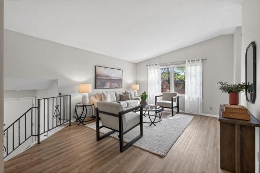 Vaulted ceilings throughout main level space creates an open and inviting feel.