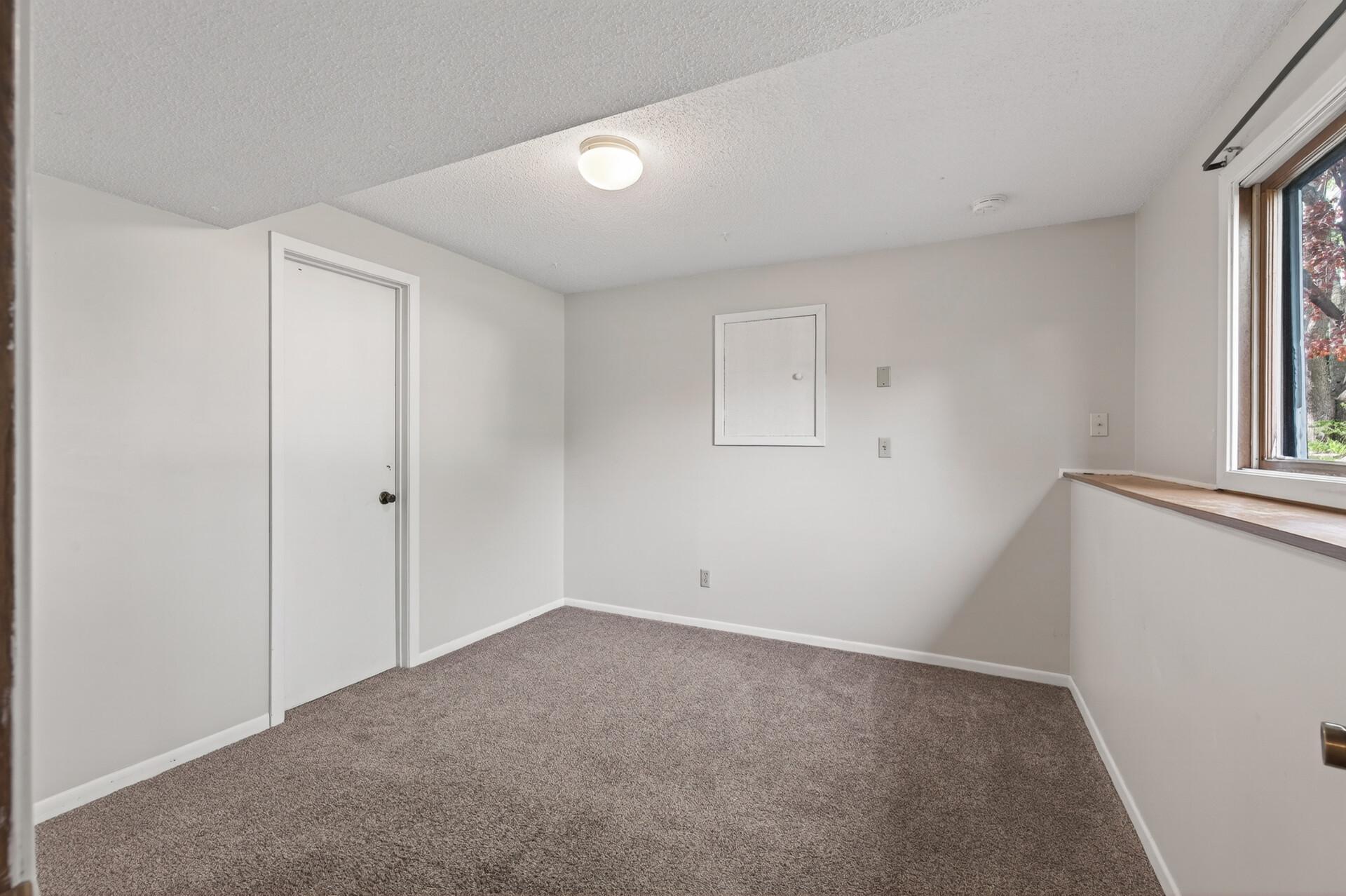 3rd lower level bedroom at ground level still feels bright and inviting