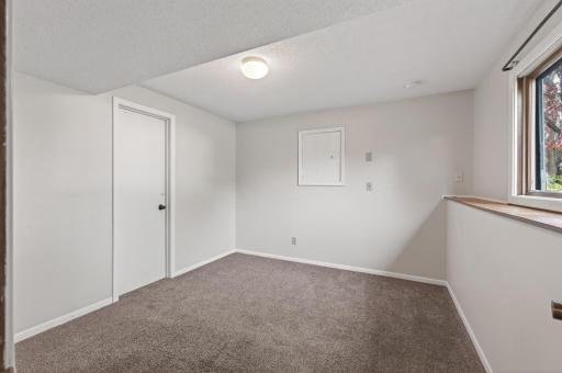3rd lower level bedroom at ground level still feels bright and inviting