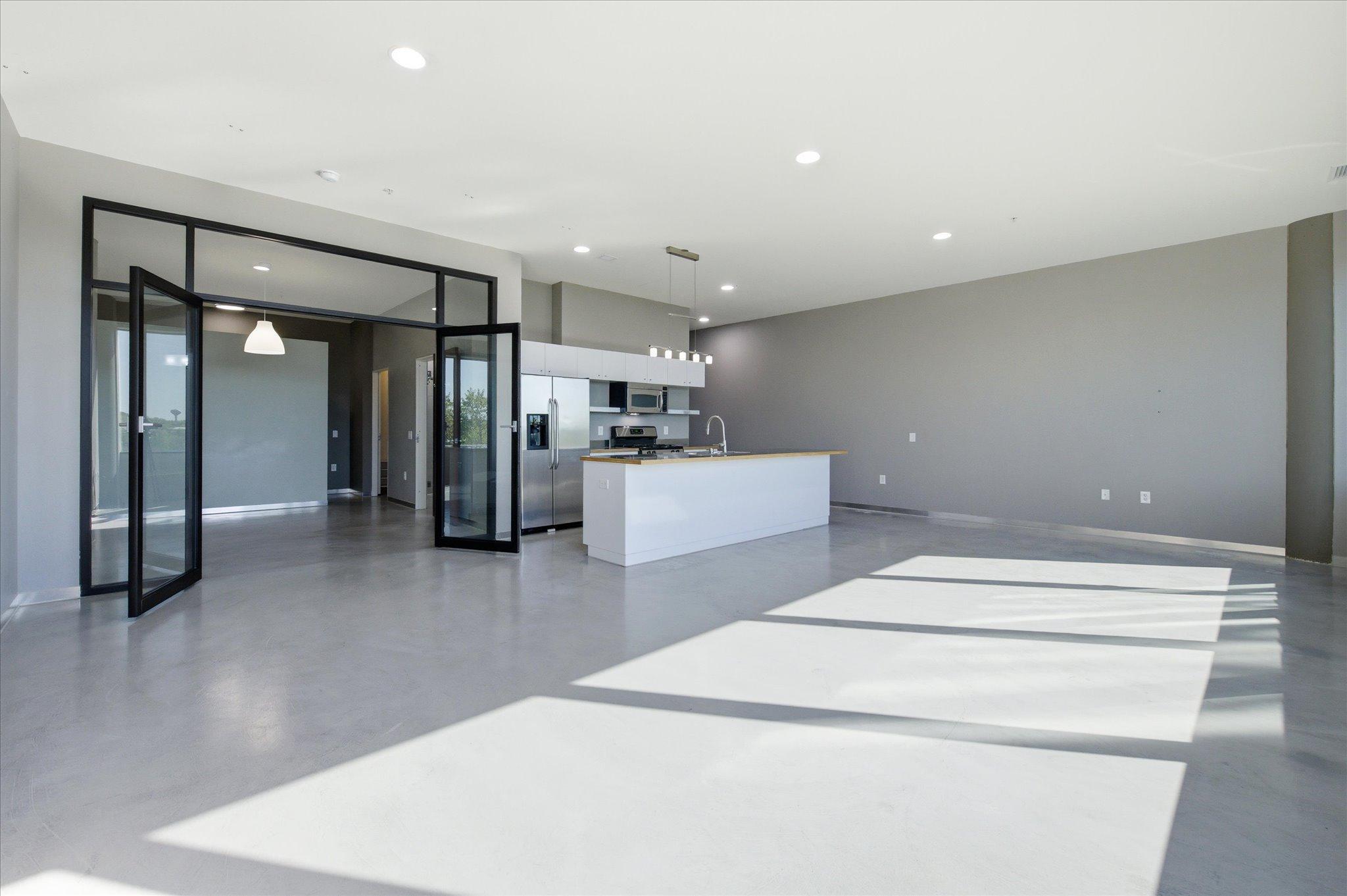 Open-concept kitchen flows effortlessly into the living area—ideal for entertaining and modern living.